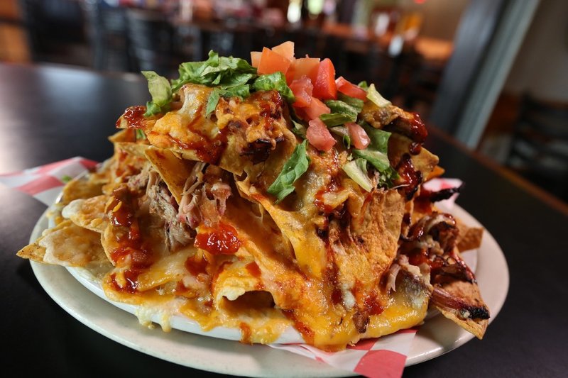 rsz_thumbnail_the_halligan_barpct27s_nachos_-_layers_and_layers_of_smoked_meatpct2c_gooey_cheesepct2c_and_spi-1.jpg